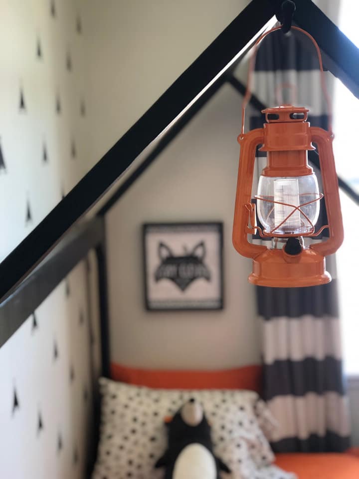 young boy bedroom with orange and black
